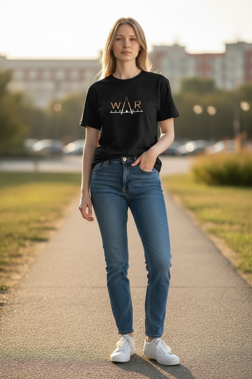Person wearing a black t-shirt with 'WAR APPAREL' logo and blue jeans standing on a path.